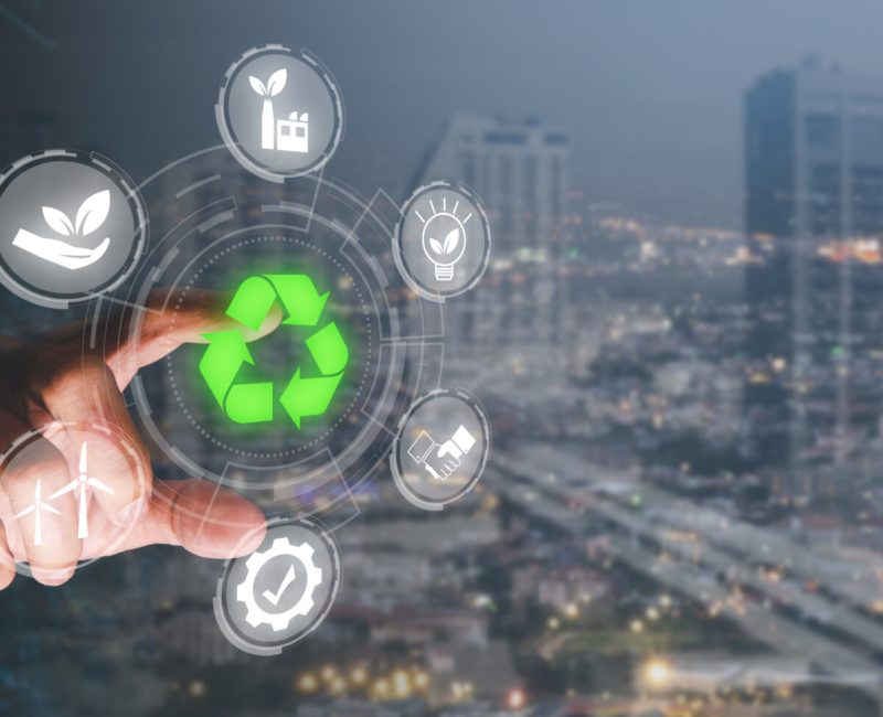 Reduce CO2 emission concept, Person hand touching CO2 icon on virtual screen, Sustainable development and green business based on renewable energy, electric transport.